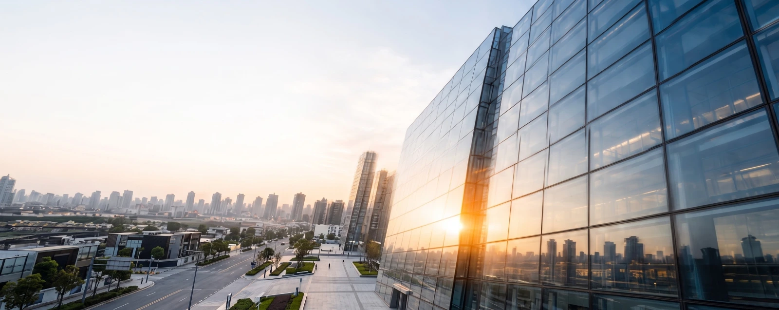 Modern glass building at sunset